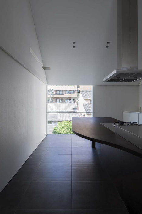 Japanese house designed around a dining table by Tsubasa Iwahashi Architects