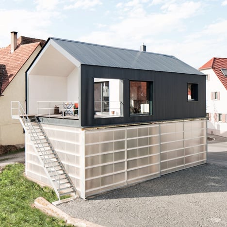 House Unimog that stores a truck within its translucent base by Fabian Evers Architecture and Wezel Architektur