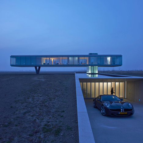 Ecological house in a glass box raised above the landscape by Paul de Ruiter Architects
