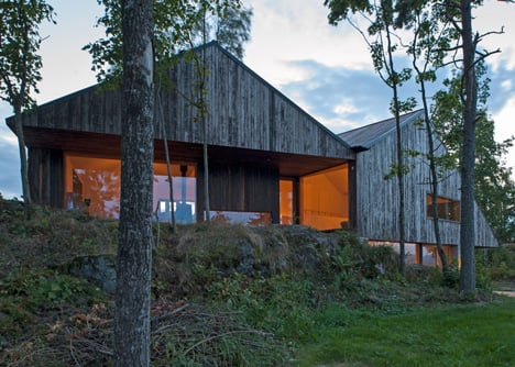 Double-gabled house overlooking a Norwegian fjord by Schjelderup Trondahl Architects