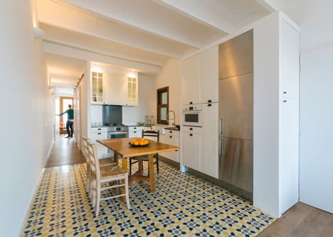 Nook Architects add patterned floor tiles and window seat to Barcelona apartment renovation