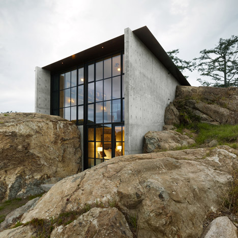 The Pierre house sits between large boulders 