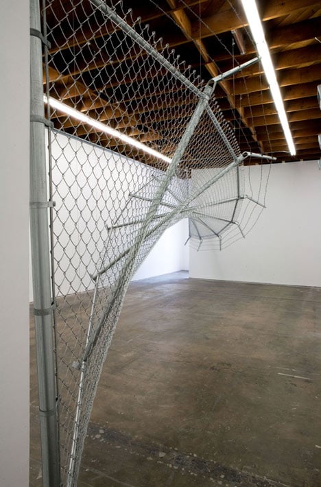 Twisting barbed wire fence installed by Didier Faustino at Cincinnatis Contemporary Arts Center