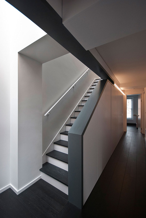 Long staircase spans converted London apartment by PATALAB Architecture