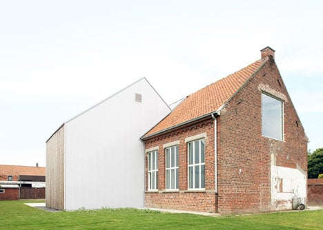 Community Centre Woesten by Atelier Tom Vanhee has a contrasting gabled extension