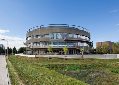 Ecological university building by BDG Architects features a cylindrical facade