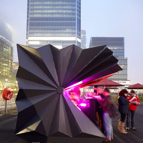 Folded metal kiosks by Make open like a paper fan