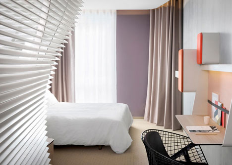 Okko hotel interior by Patrick Norguet with en suites hidden behind louvred walls