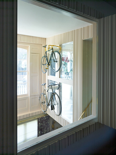 AOC Architecture adds wall-hung bicycles and basket-weave flooring to London townhouse