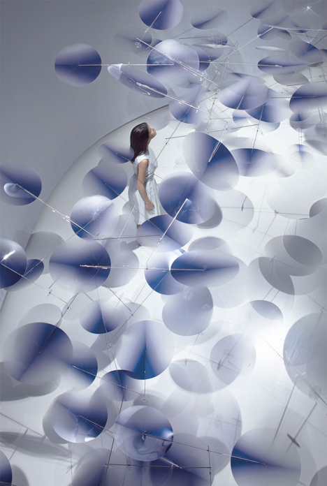 Moving plastic petals balanced in Interconnection installation by Nao Tamura