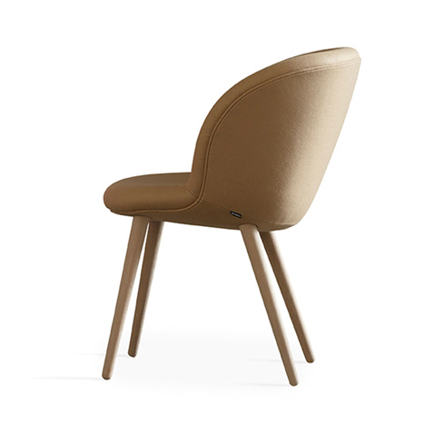 Busk and Hertzog adds wooden legs to Capri chairs for Halle