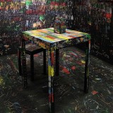 Visitors scratch walls and furniture to create coloured etchings in Itay Ohaly installation