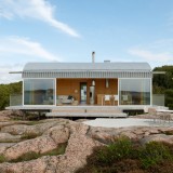 Summer house on stilts by Mats Fahlander nestles into the landscape of a Swedish fjord