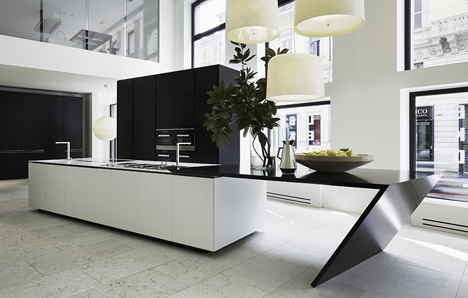 The Sharp kitchen of Poliform Varenna designed by Daniel Libeskind, uses DuPont Corian high-tech surface in the Glacier White colour for the worktop and the sink.