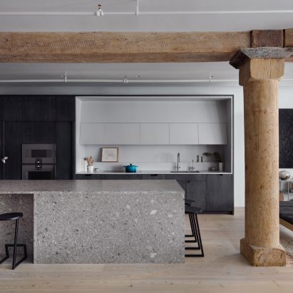 Worrell Yeung contrasts wood pillars and grey marble in Chelsea Loft