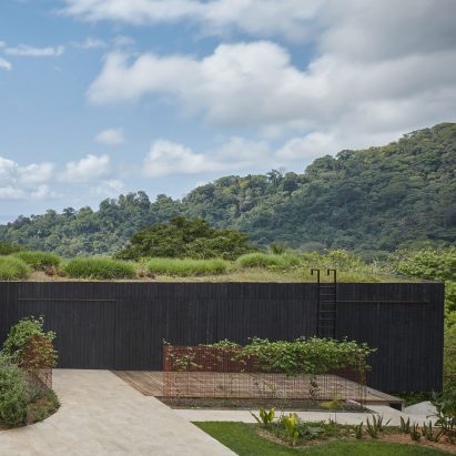 Green roof and charred wood blend Atelier Villa into Costa Rican jungle