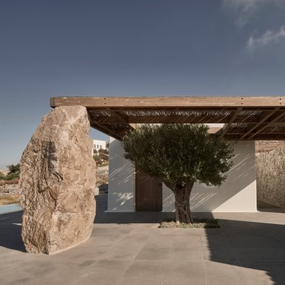 K Studio creates stone holiday home on Mykonos overlooking the Aegean Sea