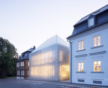 Translucent glass house built alongside historic buildings for Lasvit's Czech Republic headquarters