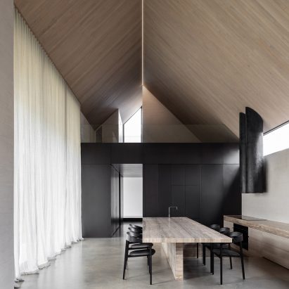 Material and spatial contrasts define Barwon Heads House by Adam Kane Architects