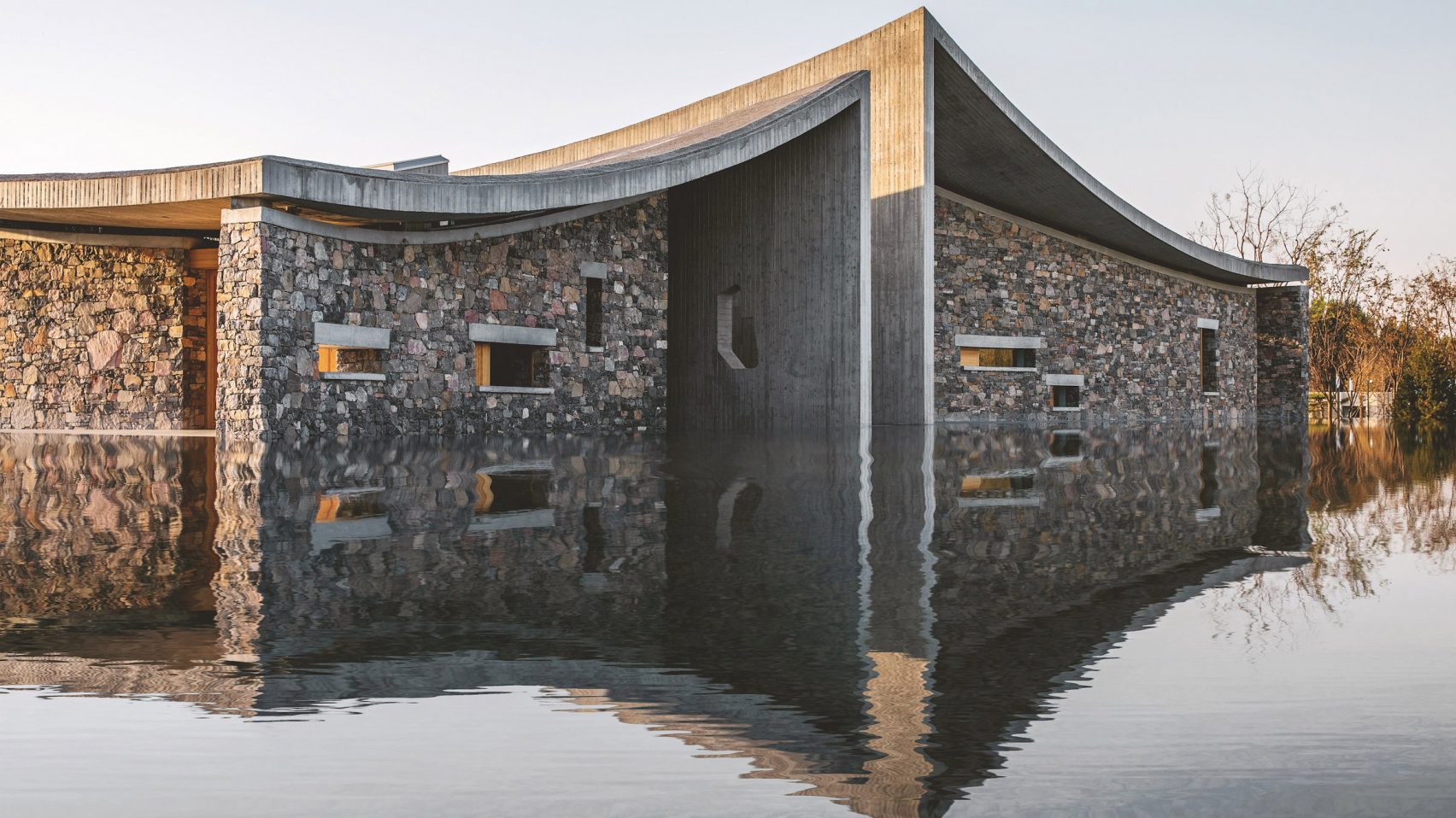 Studio Zhu Pei Tops Art Centre In China With Wave Like Concrete Roofs