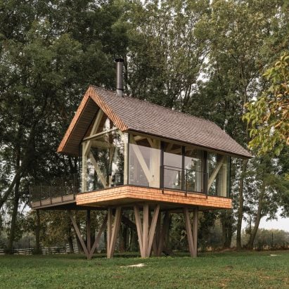Jan Tyrpekl raises glass micro home on stilts in rural Austria