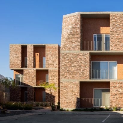 Jorge Urias unveils notched brick apartment complex in Mexico