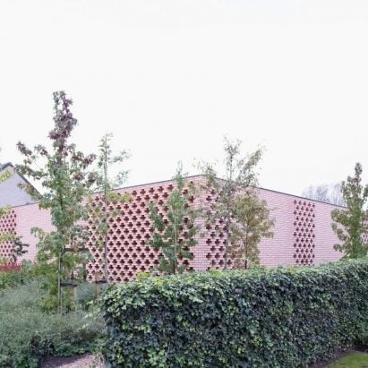 Studio Okami screens low&lying Belgian house with patterned brick walls