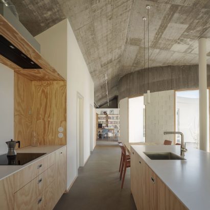 Sinaldaba organises Cecebre House in Spain around crescent-shaped courtyard