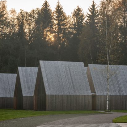 Black timber and copper cloaks Sanctum nature retreat in Lithuanian woodland