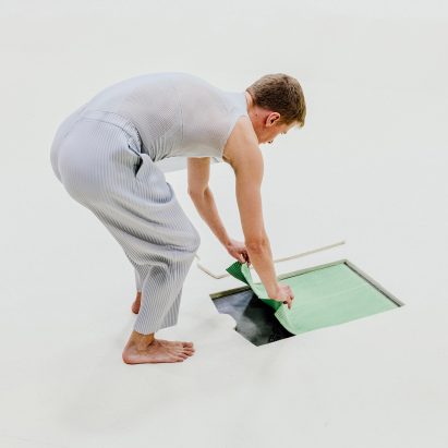 Dancers pull clothes from Tate Modern's floor for Homme Plissé Issey Miyake show