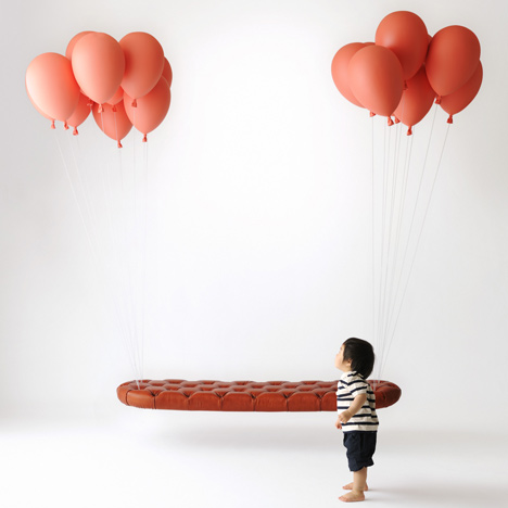 This floating bench by Japanese studio h220430 appears to be held up by bunches of balloons at either end.