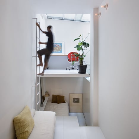 Tiny Madrid apartment by MYCC with rooms connected by a ladder