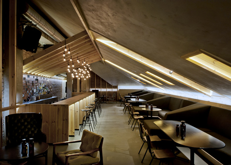 Bar in an attic space in Minsk by Inblum Architects