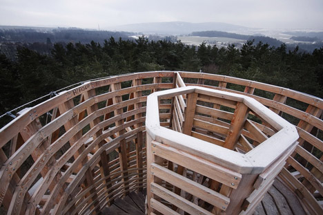Timber observation tower shaped like a cucumber by Mjölk Architekti