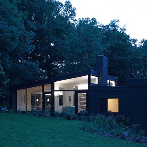 Black brick house in the woods by Takero Shimazaki and Charlie Luxton