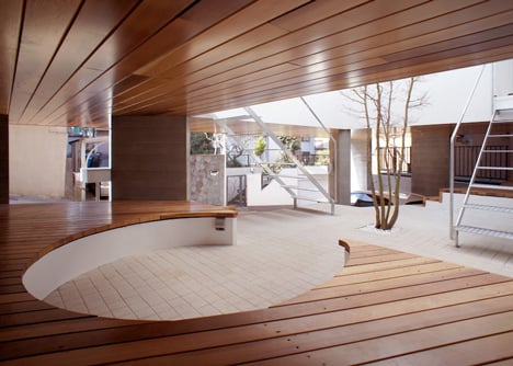 House by Kazuhiko Kishimoto with a public seating deck and gallery underneath