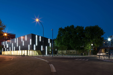 Parisian sports hall by Ateliers O-S Architectes with bands of light on its walls 