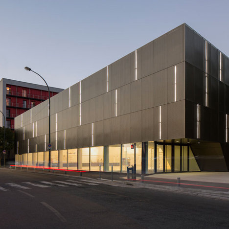Parisian sports hall by Ateliers O-S Architectes with bands of light on its walls