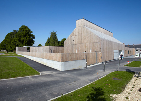 Timber-clad kindergarten in France by Topos Architecture