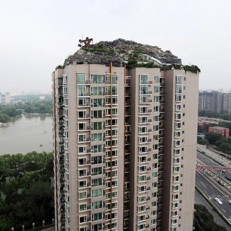 Man ordered to remove fake mountain villa on top of Chinese tower