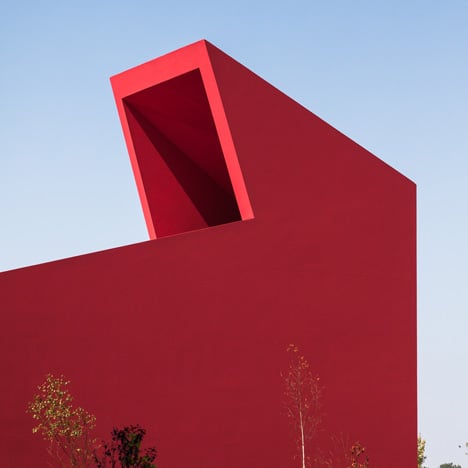 Art and culture centre with bright red walls by Future Architecture Thinking