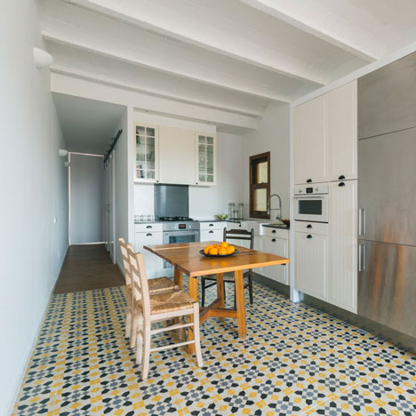 Nook Architects add patterned floor tiles and window seat to Barcelona apartment renovation