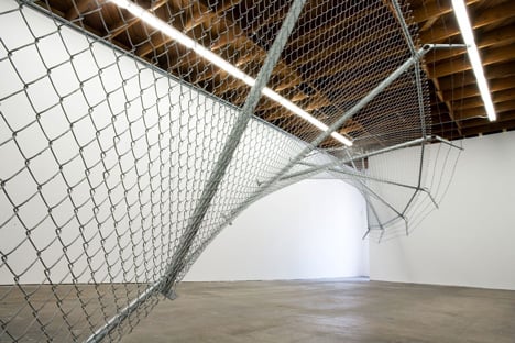 Twisting barbed wire fence installed by Didier Faustino at Cincinnatis Contemporary Arts Center