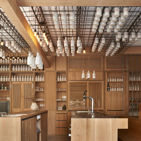Buero Wagner suspends bottles of foraged ingredients from ceiling of cocktail bar