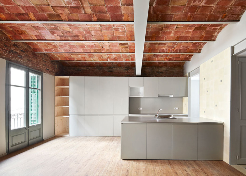 Vaulted Brick Ceilings Revealed Inside Barcelona Apartment