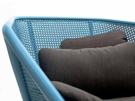 Colony armchair by Skrivo mixes steam-bent wood and rattan