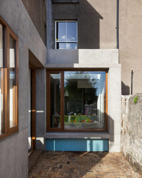 House extension by GKMP Architects includes a wooden window seat