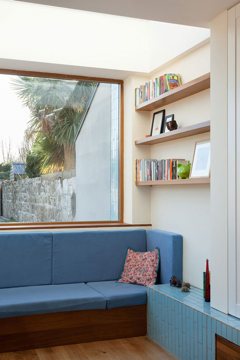 House extension by GKMP Architects includes a wooden window seat