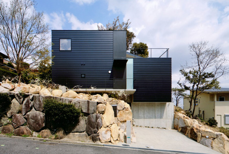 Krampon house by Shogo Aratani climbs over a rocky site