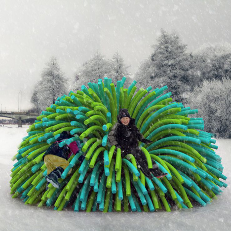 Shelters resembling giant pompoms by&ltbr /&gt RAW Design warm skaters on a frozen river